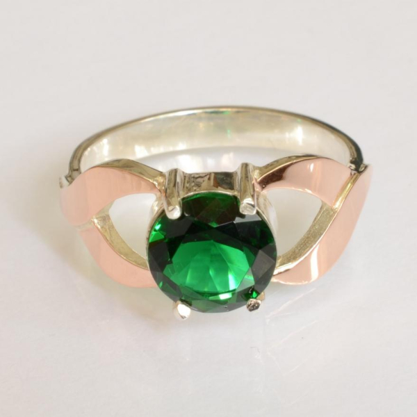 Срібна каблучка з золотими вставками