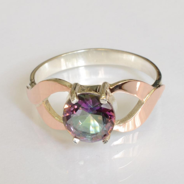 Срібна каблучка з золотими вставками