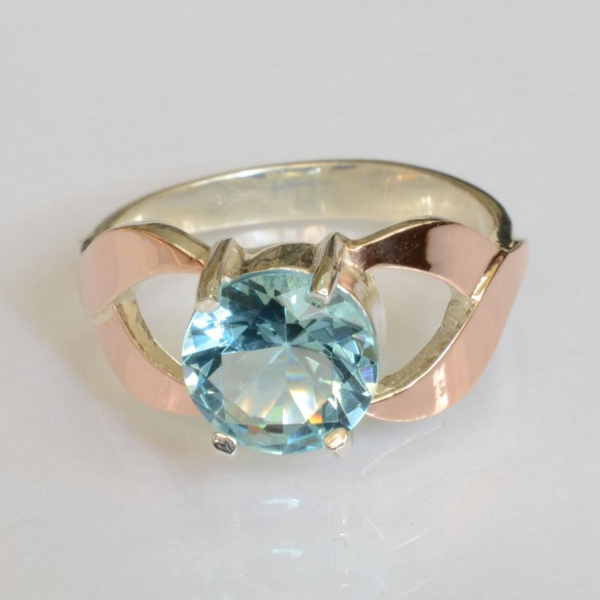 Срібна каблучка з золотими вставками