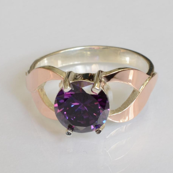 Срібна каблучка з золотими вставками