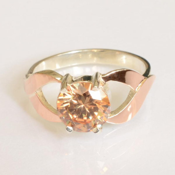 Срібна каблучка з золотими вставками