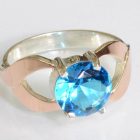 Срібна каблучка з золотими вставками