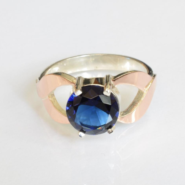 Срібна каблучка з золотими вставками