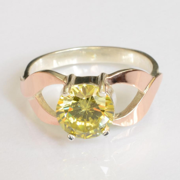 Срібна каблучка з золотими вставками