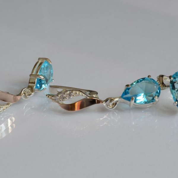 Срібний набір з золотими пластинами