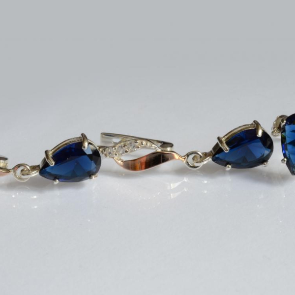 Срібний набір з золотими пластинами