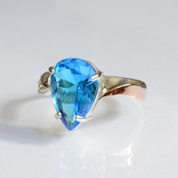 Срібна каблучка з золотими вставками