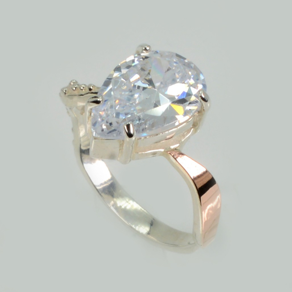 Срібна каблучка з золотими вставками