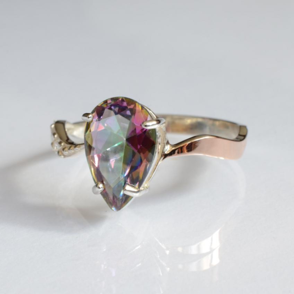 Срібна каблучка з золотими вставками