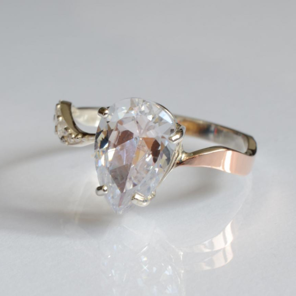 Срібна каблучка з золотими вставками