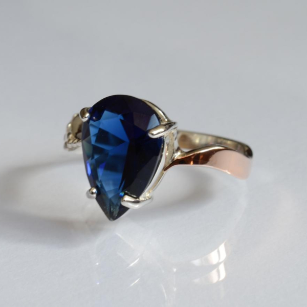 Срібна каблучка з золотими вставками