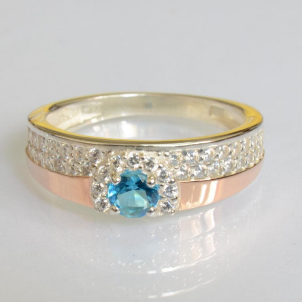 Срібна каблучка з золотими вставками