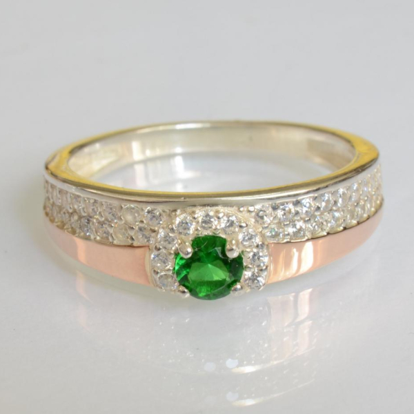 Срібна каблучка з золотими вставками