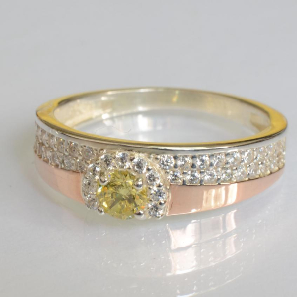 Срібна каблучка з золотими вставками