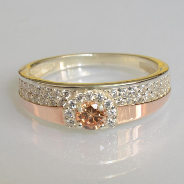 Срібна каблучка з золотими вставками