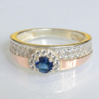 Срібна каблучка з золотими вставками