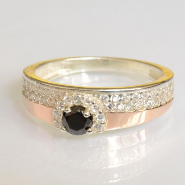 Срібна каблучка з золотими вставками