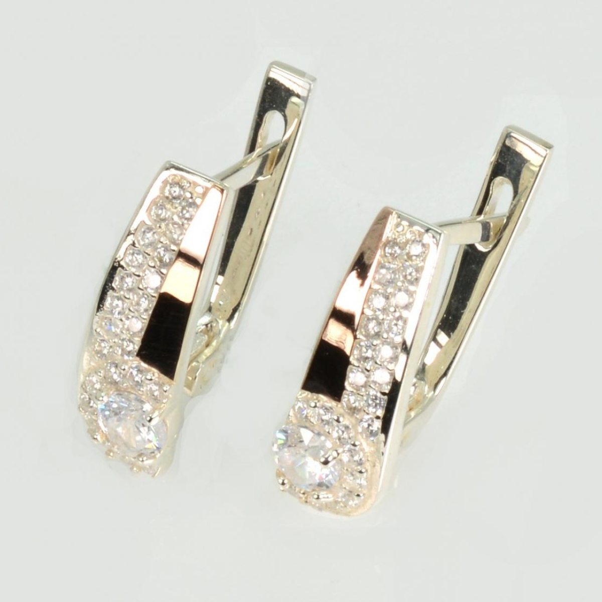 Срібні сережки з золотими пластинами