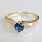 Срібна каблучка з золотими вставками