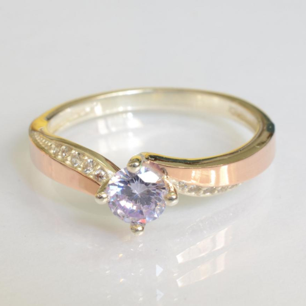 Срібна каблучка з золотими вставками