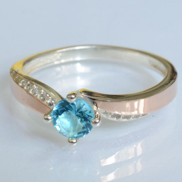 Срібна каблучка з золотими вставками