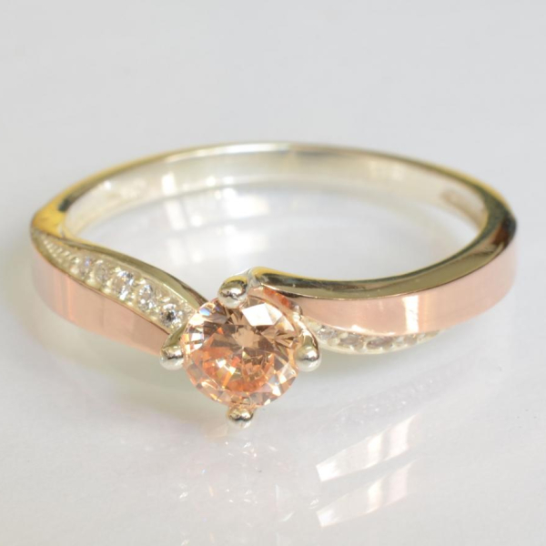 Срібна каблучка з золотими вставками