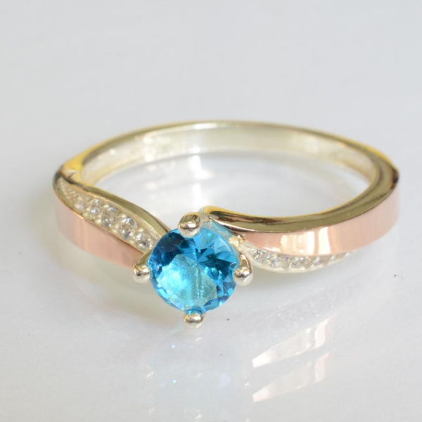 Срібна каблучка з золотими вставками