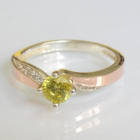 Срібна каблучка з золотими вставками