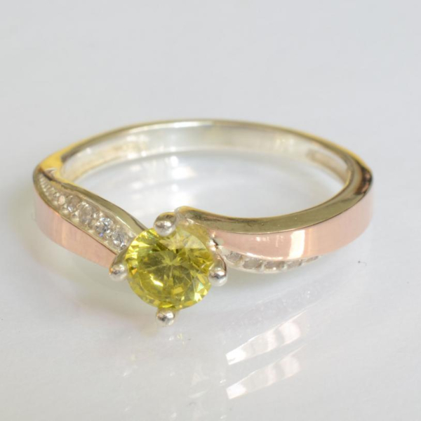 Срібна каблучка з золотими вставками