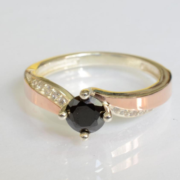 Срібна каблучка з золотими вставками