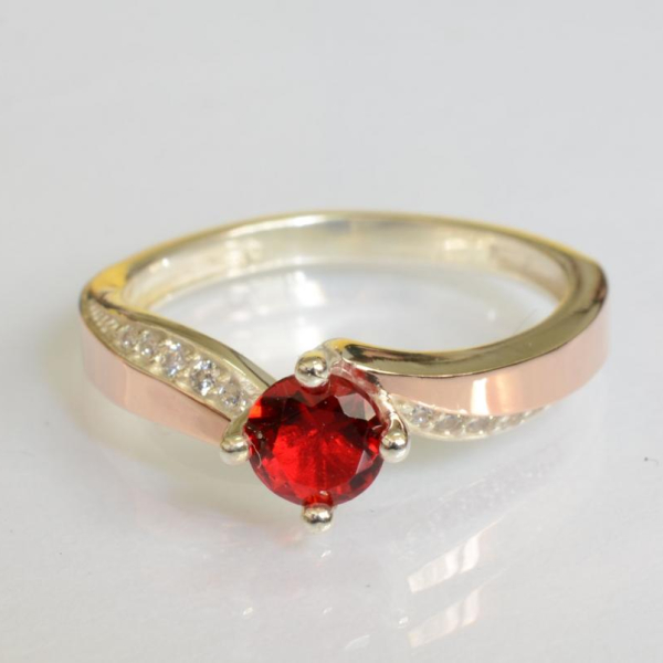 Срібна каблучка з золотими вставками