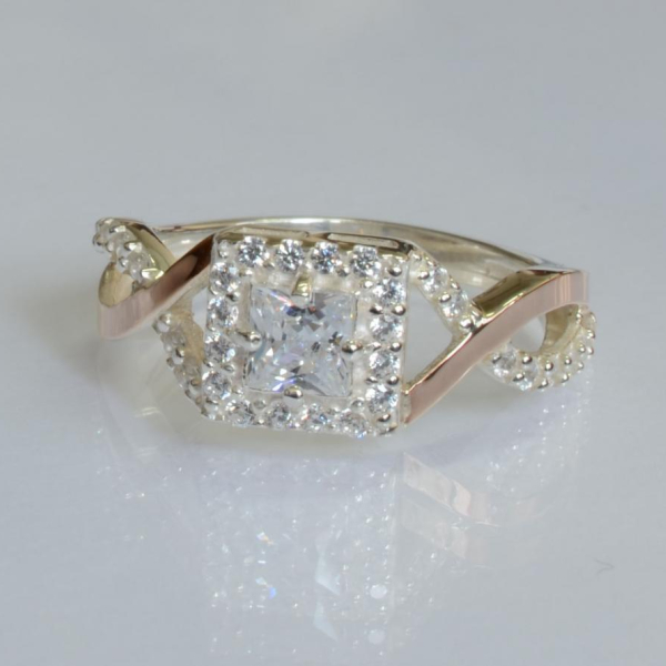 Срібна каблучка з золотими вставками