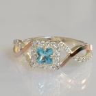 Срібна каблучка з золотими вставками