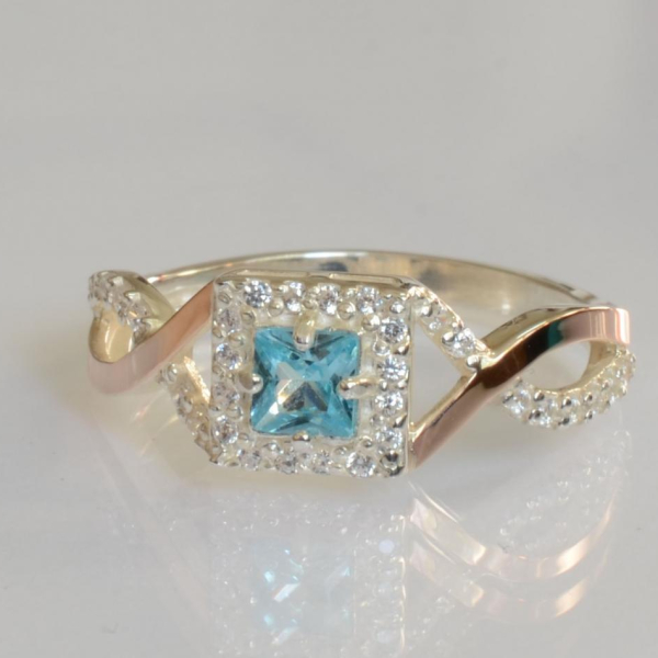 Срібна каблучка з золотими вставками