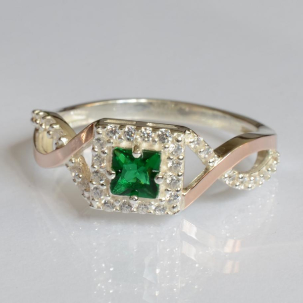 Срібна каблучка з золотими вставками