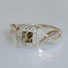 Срібна каблучка з золотими вставками