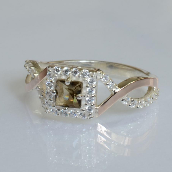 Срібна каблучка з золотими вставками