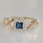 Срібна каблучка з золотими вставками