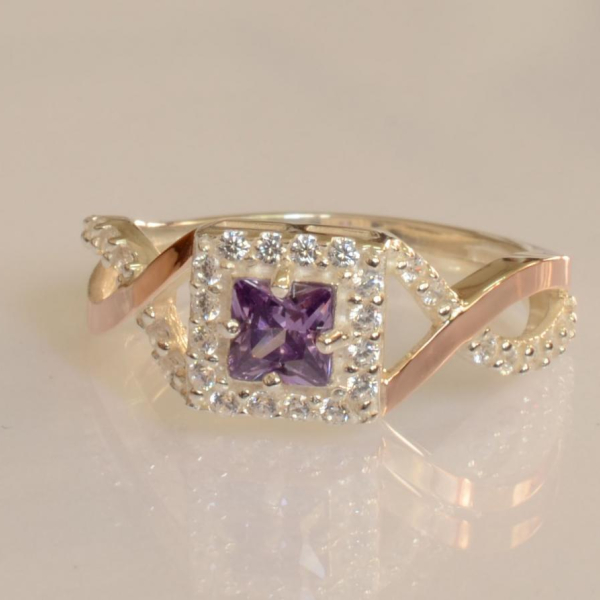 Срібна каблучка з золотими вставками