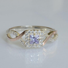 Срібна каблучка з золотими вставками