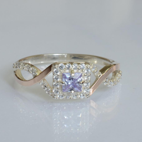 Срібна каблучка з золотими вставками