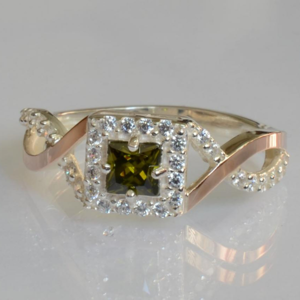 Срібна каблучка з золотими вставками