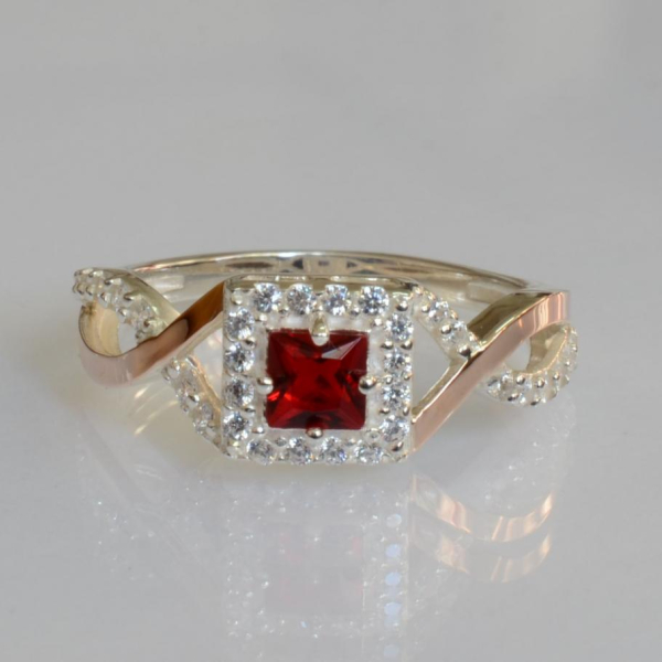 Срібна каблучка з золотими вставками