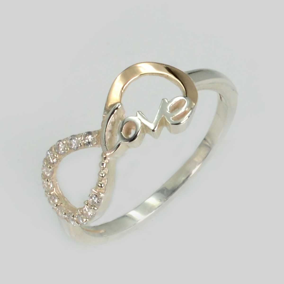 Срібна каблучка з золотими вставками