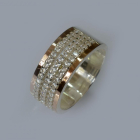 Срібна каблучка з золотими вставками