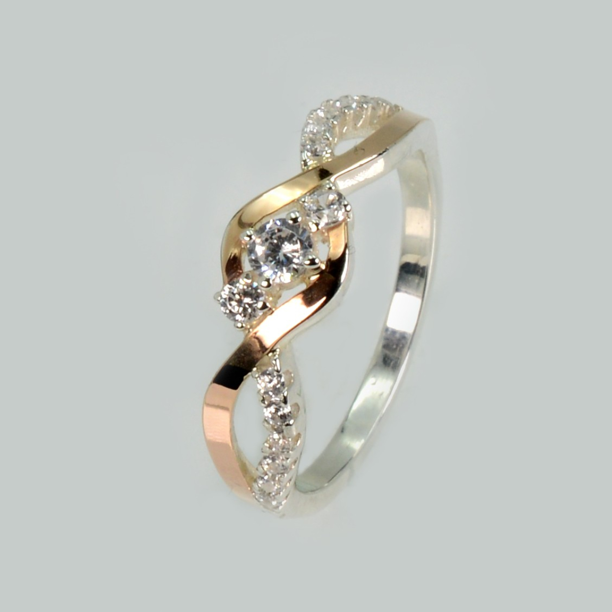 Срібна каблучка з золотими вставками