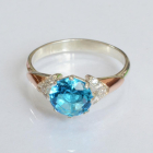 Срібна каблучка з золотими вставками