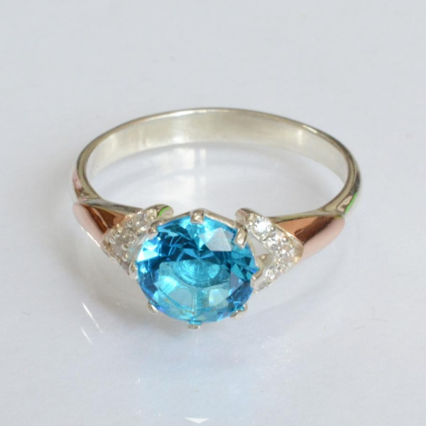 Срібна каблучка з золотими вставками