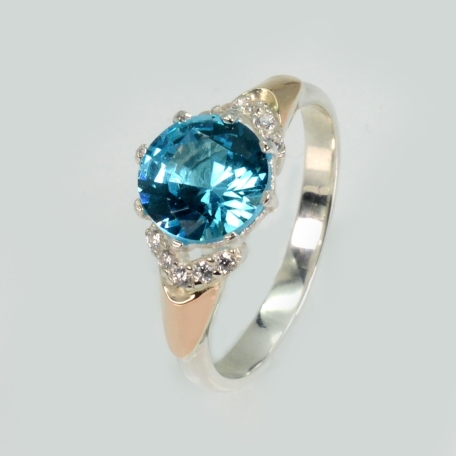 Срібна каблучка з золотими вставками