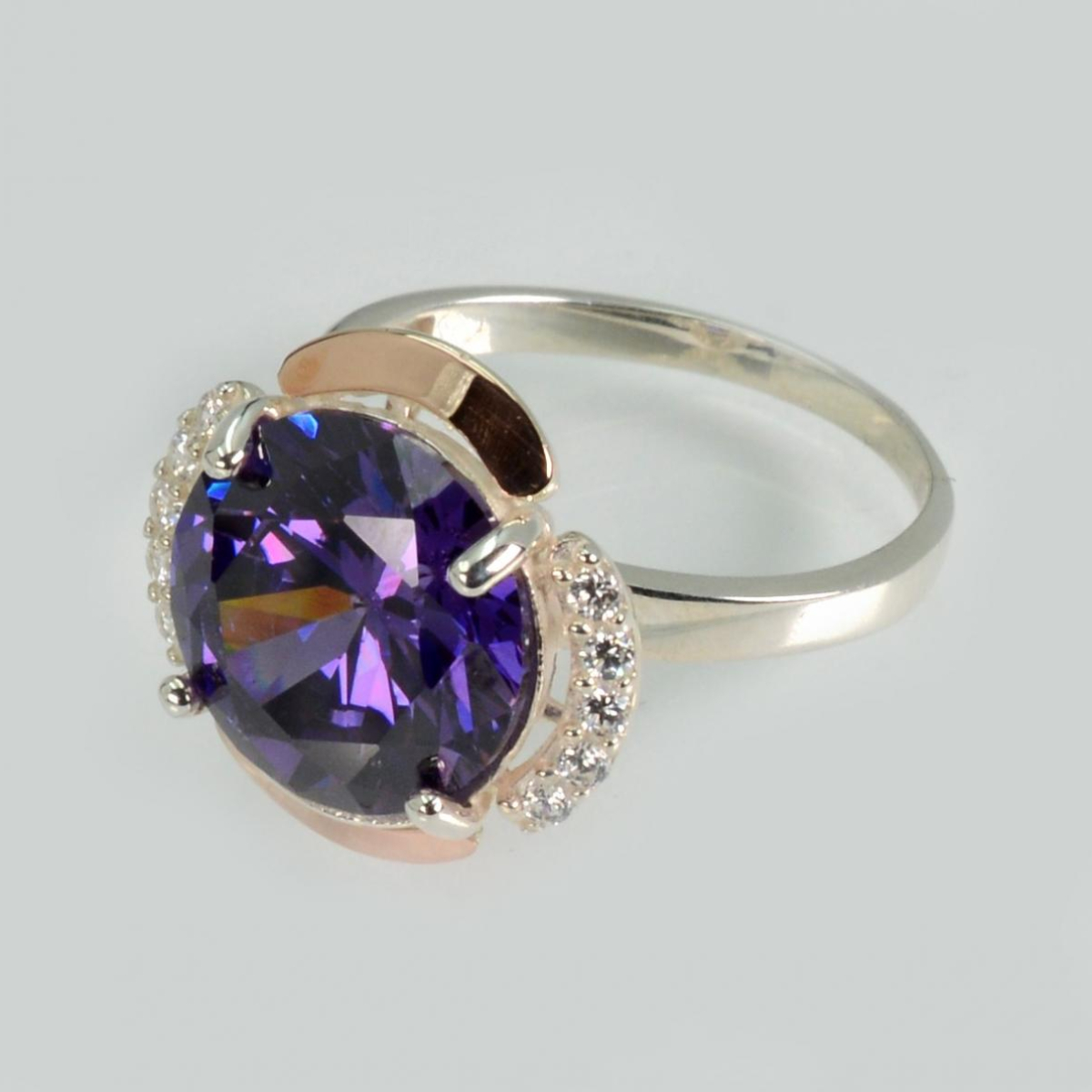 Срібна каблучка з золотими вставками